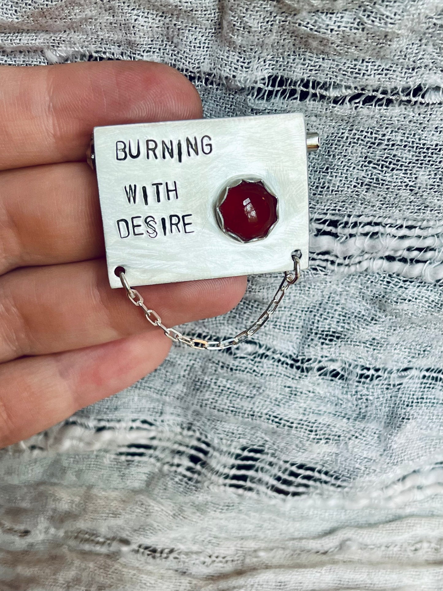 burning with desire brooch
