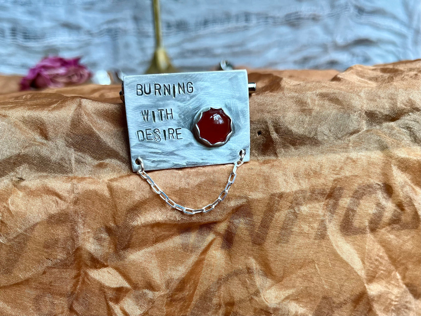 burning with desire brooch