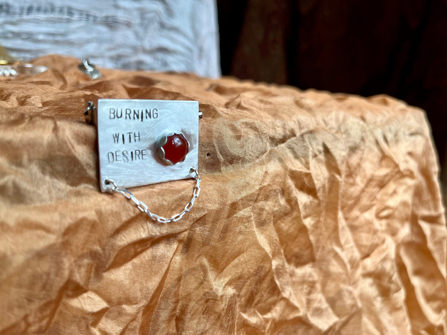 burning with desire brooch