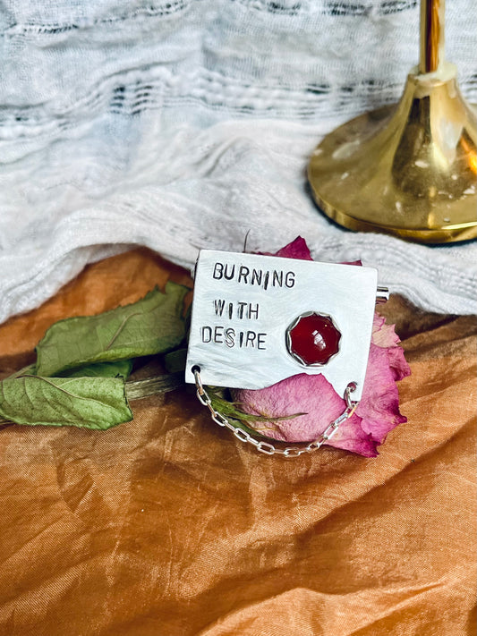 burning with desire brooch